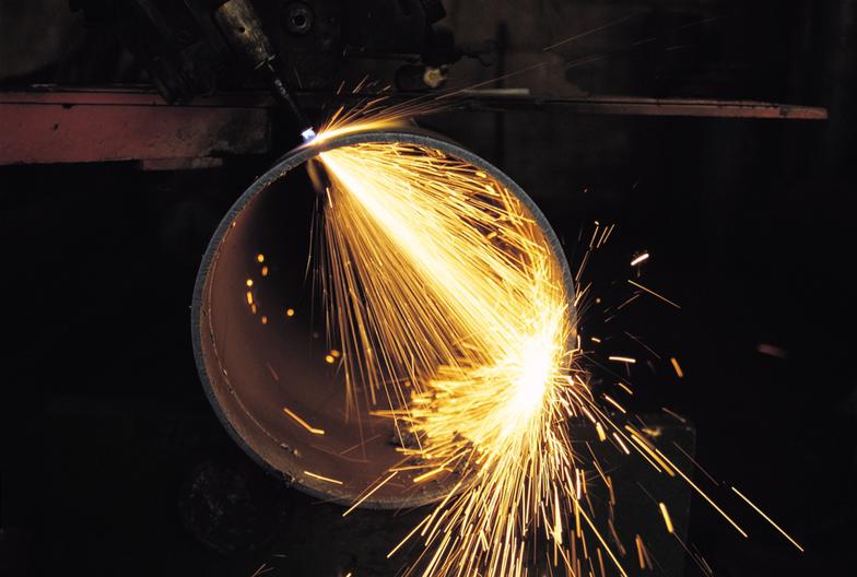sparks flying from metal cutting torch